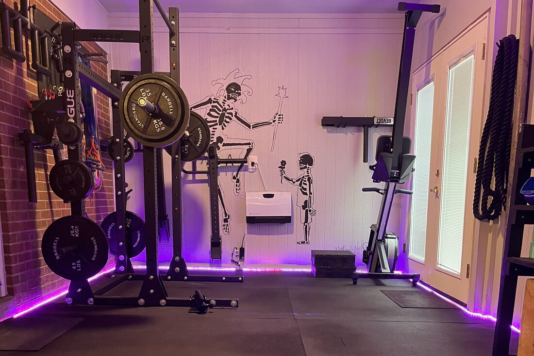 The finished garage gym, lit purple