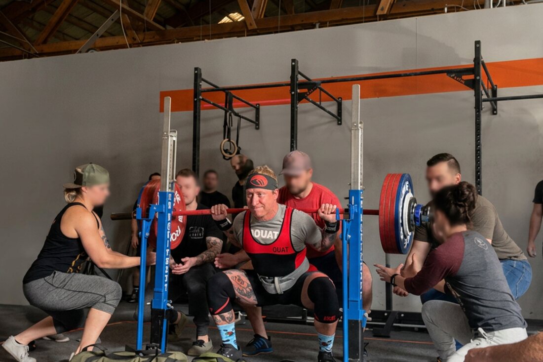Mike at the bottom of a heavy squat at a powerlifting meet